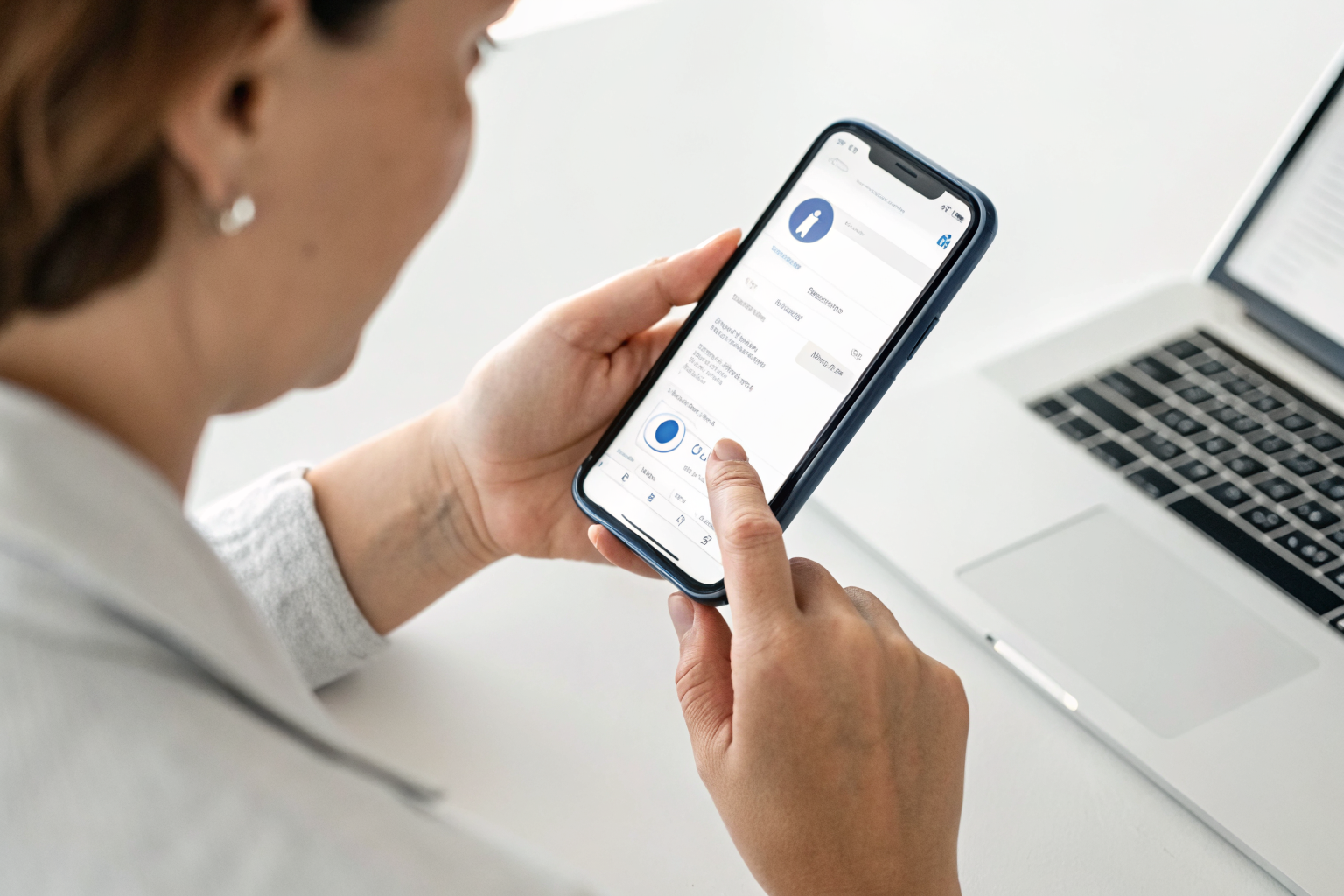 Person using a smartphone with 'Send Message' button on a Meta ad.