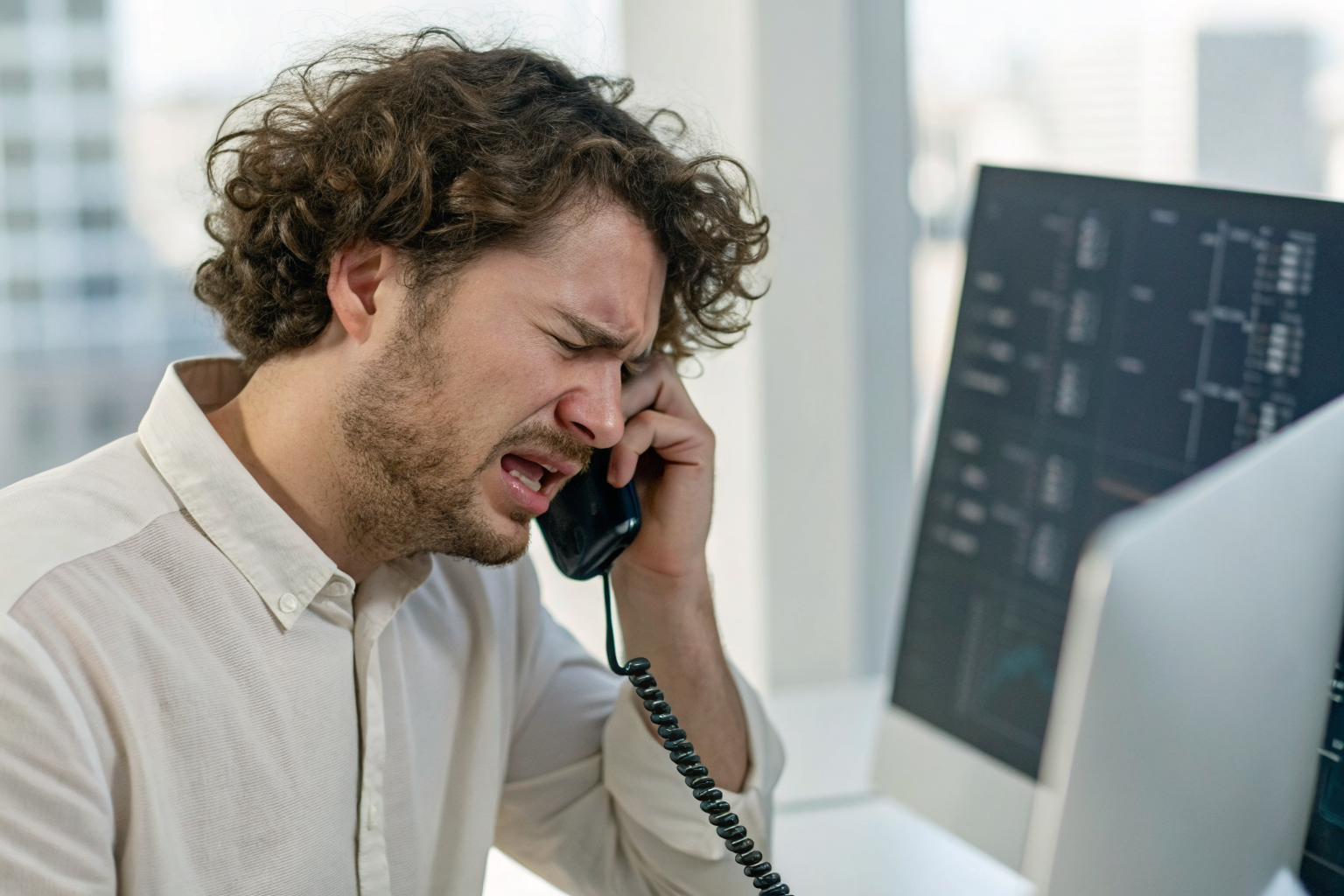 Frustrated caller with AI interface showing unsuccessful handoff.