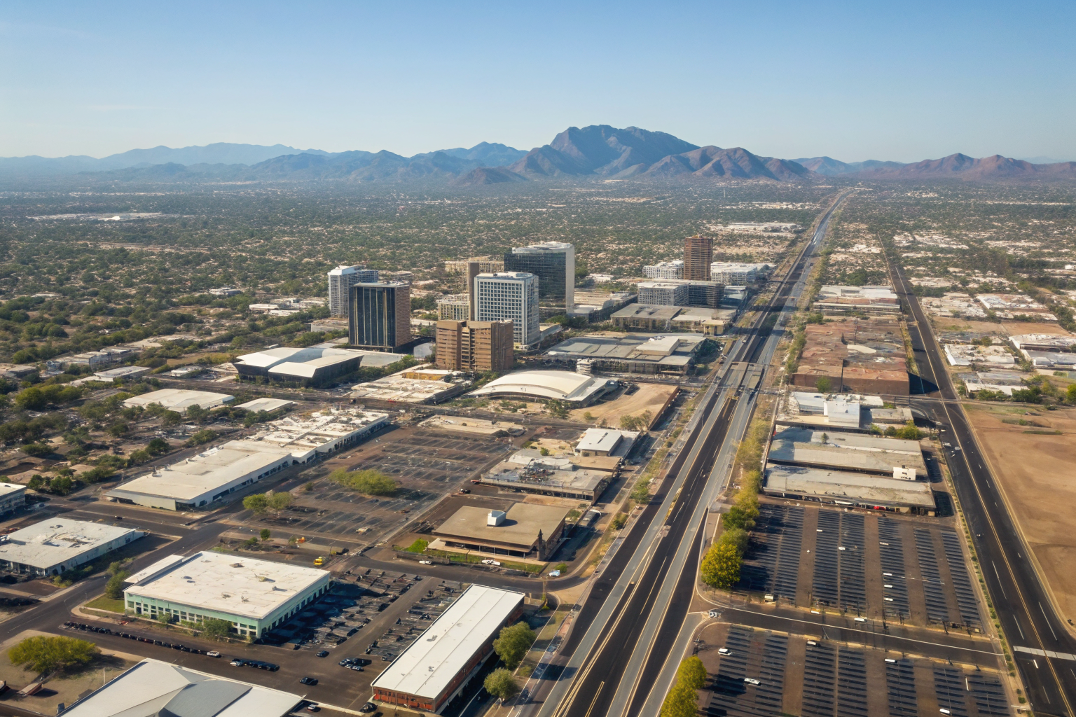Aerial view of Tempe business corridors with highlighted districts.