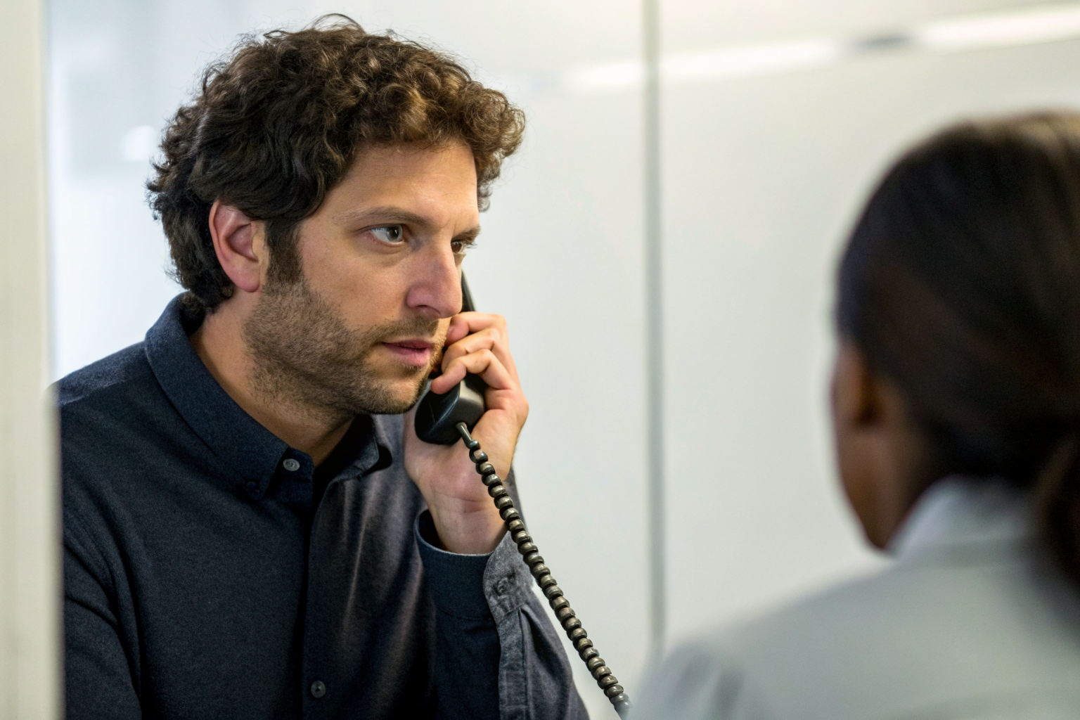Caller listens attentively during phone conversation